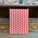 Notebook. Fabric. White stars print red background.
