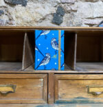 Libreta. Tela. Estampado pájaro fondo azul.