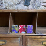 Assorted minibooks (Pack of 3). Japanese fabric with golden and silver motifs over blue,red and purple background.