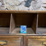 Minibook. Turquoise and blue floral Japanese fabric with golden motifs.