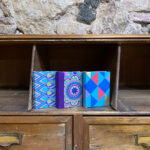 Assorted minibooks (Pack of 3). Assorted handmade papers with golden motifs.